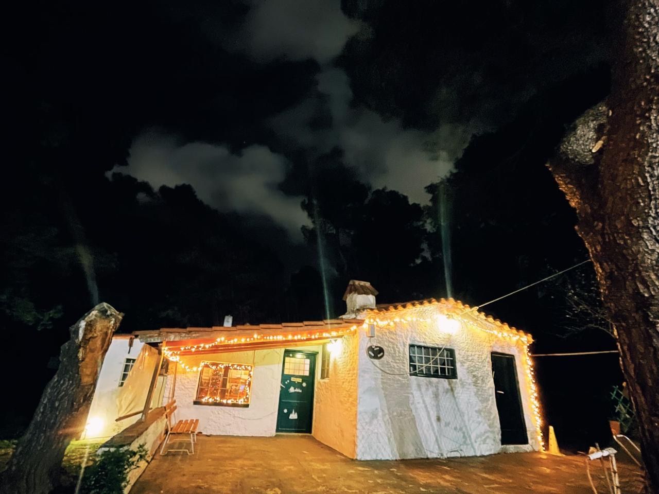 The little house wrapped in fairy lights